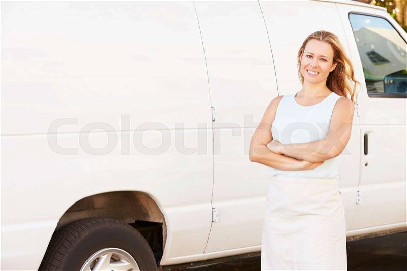 Woman Wearing Apron Standing In Front Of Van, stock photo