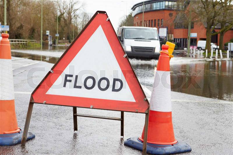 Warning Traffic Sign On Flooded Road, stock photo