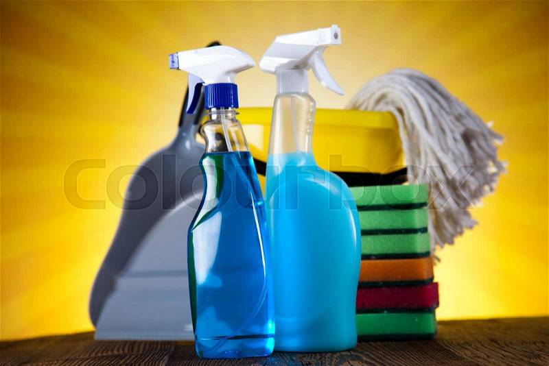Cleaning products and sunset, home work colorful theme, stock photo