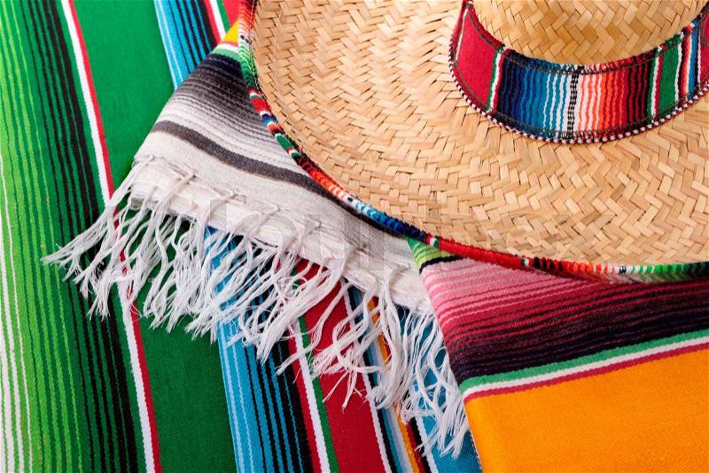 Traditional Mexican serape blankets or rugs with sombrero, stock photo