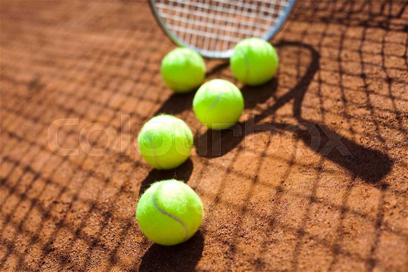 Tennis racket and balls, court, stock photo