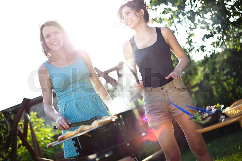 Two girls on grill, natural colorful tone, stock photo