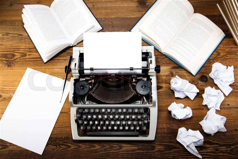 Typewriter and a blank sheet of paper, stock photo