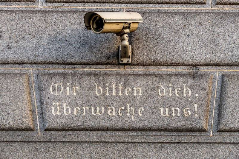 Surveillance camera on a building, symbol of monitoring, home security, control, data protection, stock photo