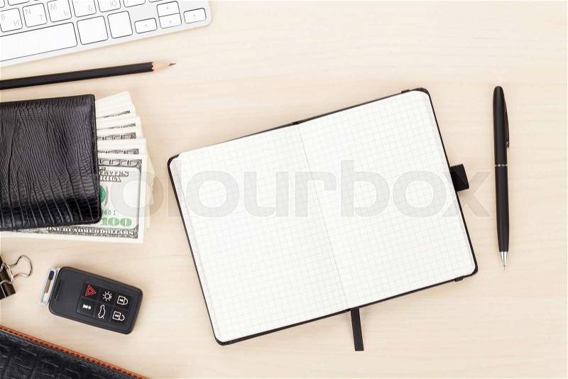 Office table with pc, supplies and money cash. View from above with copy space, stock photo