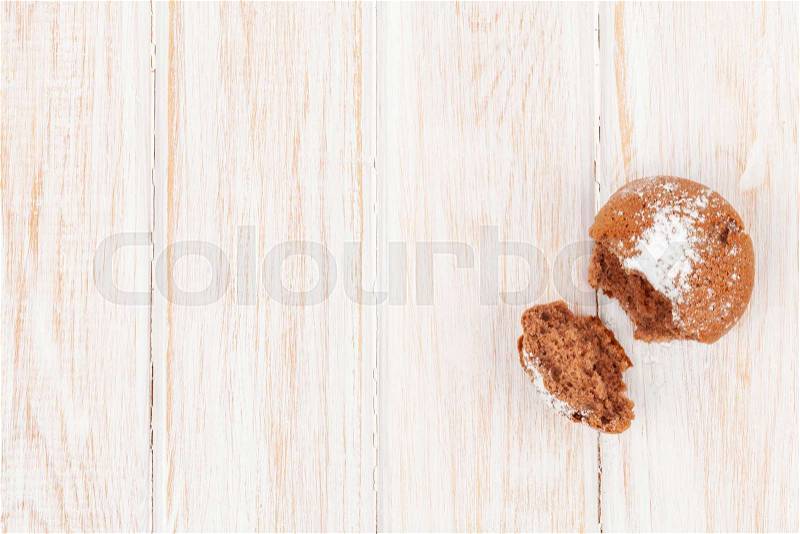 Homemade cake on white wooden table. Top view with copy space, stock photo