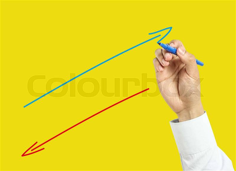 Businessman is drawing positive and negative concept with marker on transparent board with yellow background, stock photo