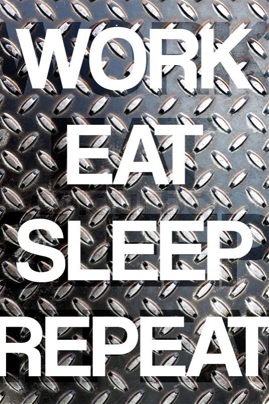 Diamond plate texture with the words WORK EAT SLEEP REPEAT to illustrate daily life responsibilities of a busy working person, stock photo