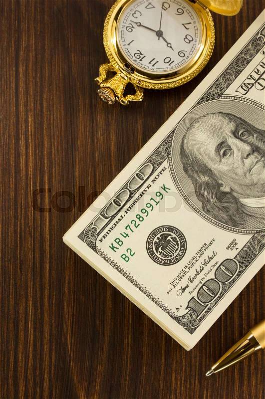 Dollars money banknotes on wooden background, stock photo