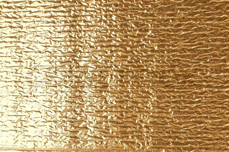 Gold aluminum foil texture closeup , can be used for background, stock photo