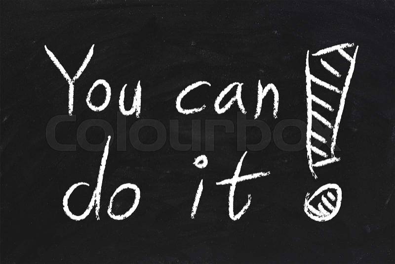 You Can Do It text is written by chalk on blackboard, stock photo