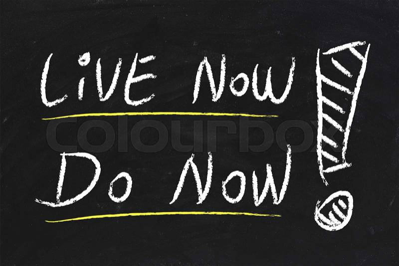 Live Now and Do Now text is written by chalk on blackboard, stock photo