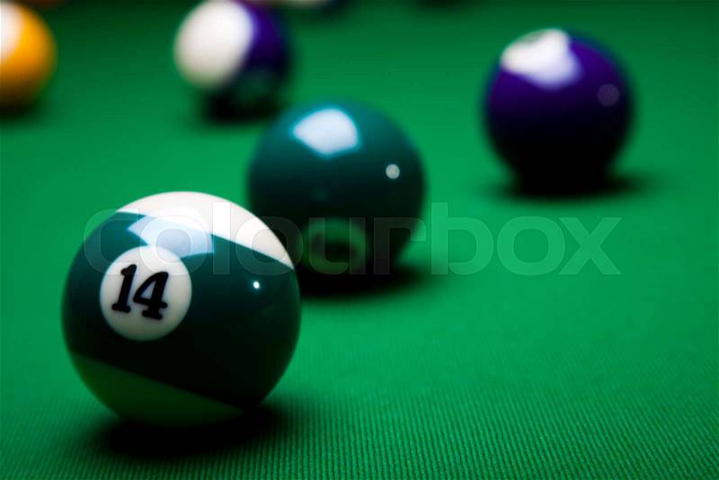 Pool game balls against a green, stock photo