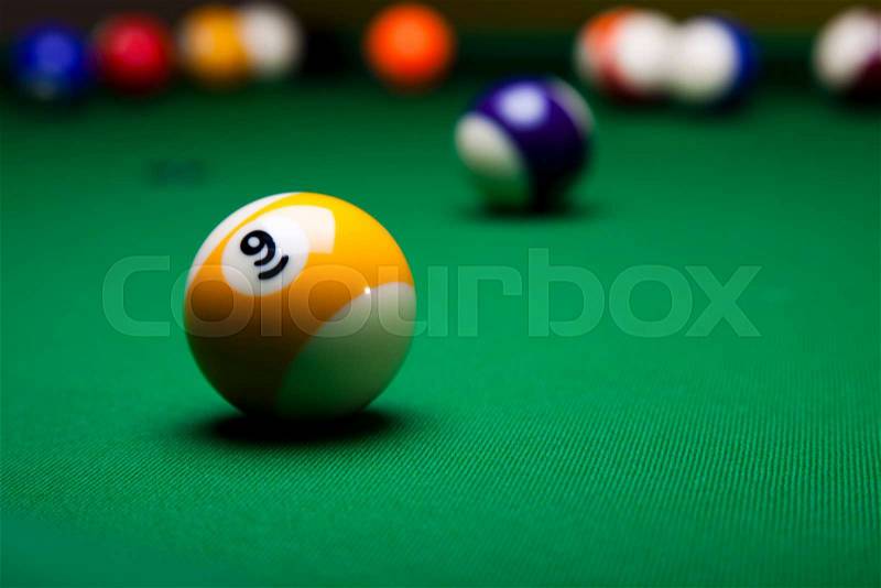 Pool game balls against a green, stock photo