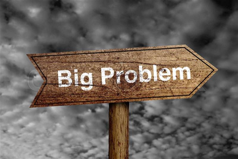 Big Problem wooden road sign with dark cloudy sky background, stock photo