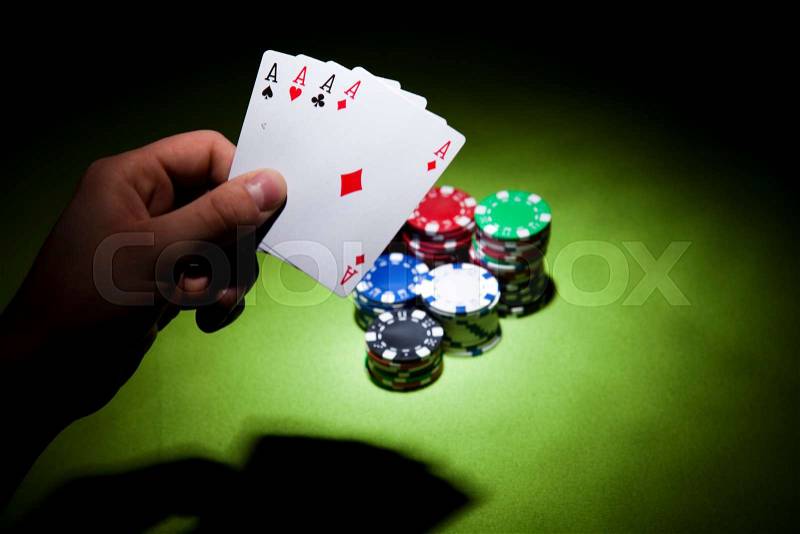 Playing cards in casino, ambient light saturated theme, stock photo