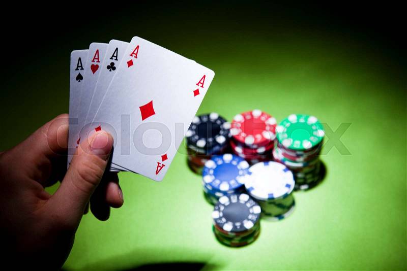 Playing cards in casino, ambient light saturated theme, stock photo