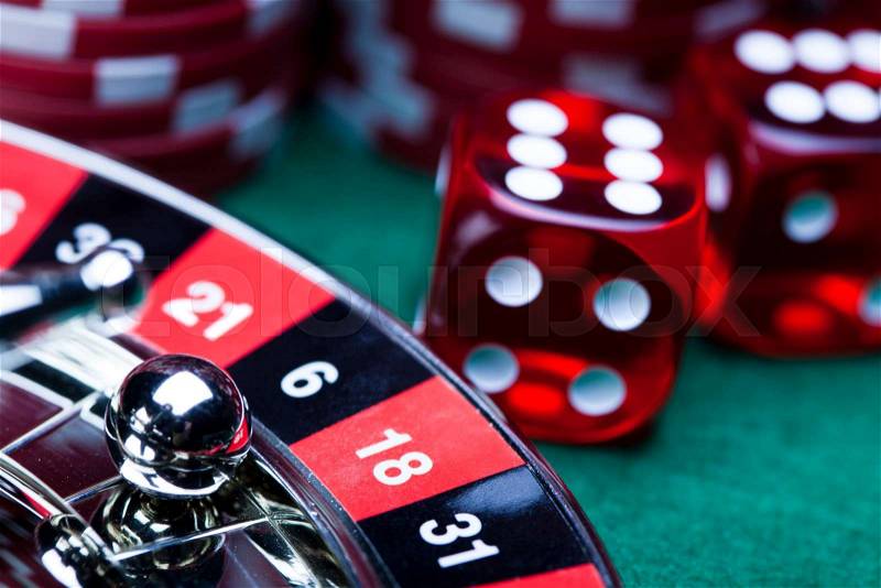13407164-casino-roulette-and-chips-elegant-gambling-theme.jpg