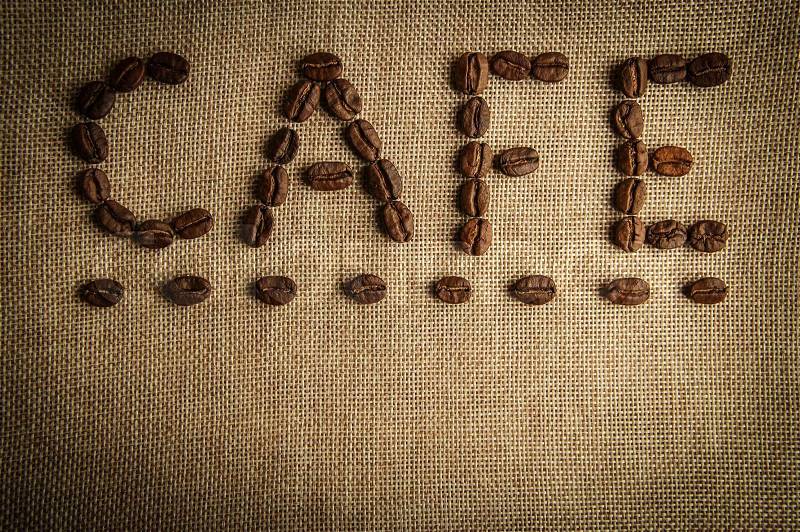 Roasted coffee beans making the word 