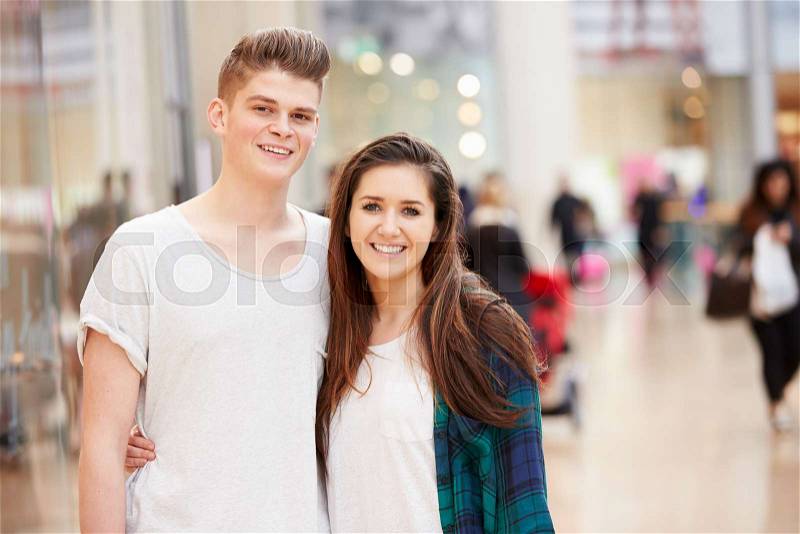 Young Couple Shopping Mall In Mall Together, stock photo