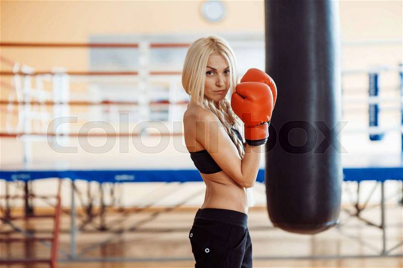 Boxing training blond woman sparring , stock photo