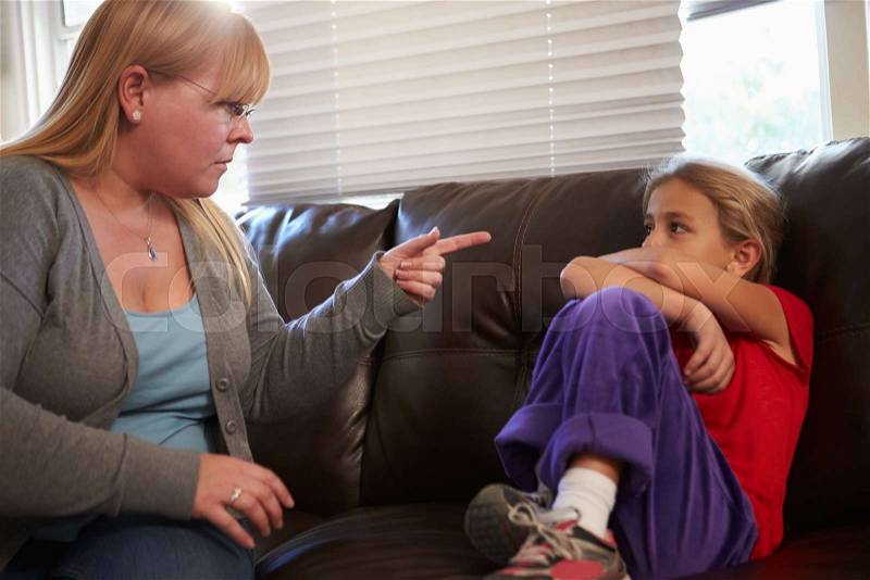 Mother Telling Off Daughter At Home, stock photo