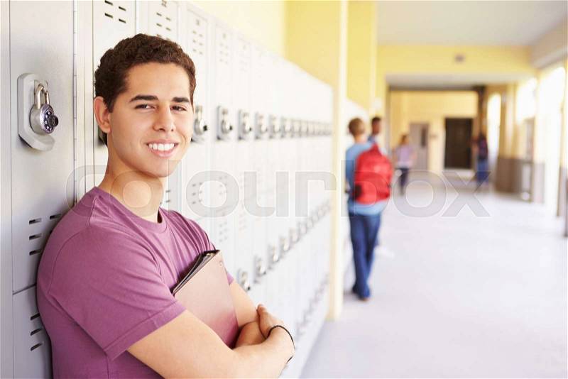Male High School Student Standing By Lockers, stock photo