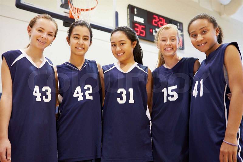 Members Of Female High School Basketball Team, stock photo