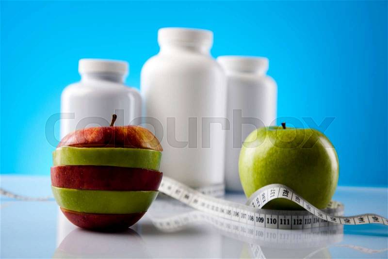 Fitness supplement and blue background, stock photo