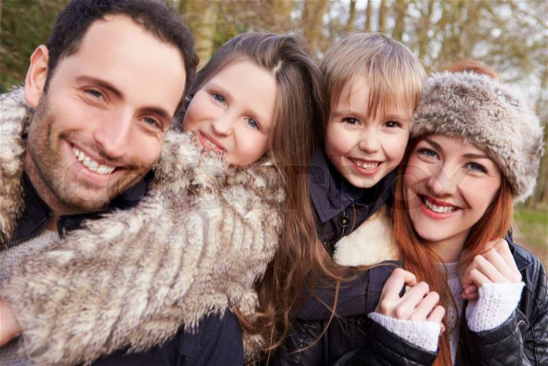 Portrait Of Family On Winter Countryside Walk Together, stock photo