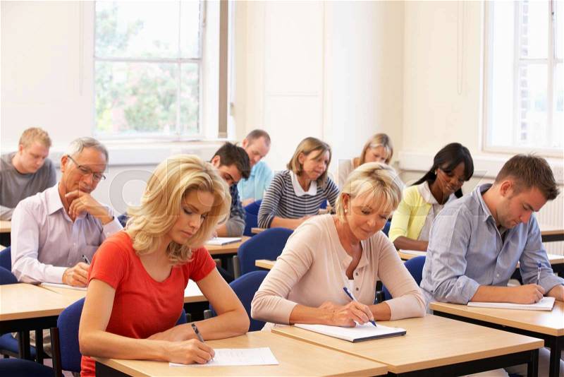 Mixed group of students in class, stock photo