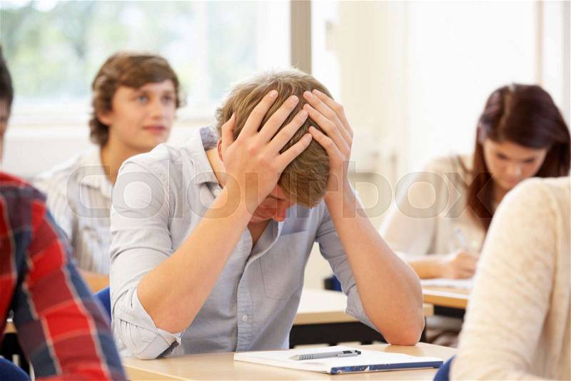 Student struggling in class, stock photo