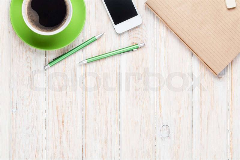 Office desk table with supplies and coffee cup. Top view with copy space, stock photo