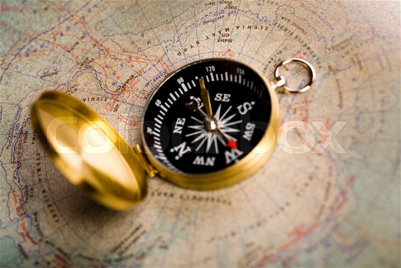 Compass, Old map, ambient light travel theme, stock photo