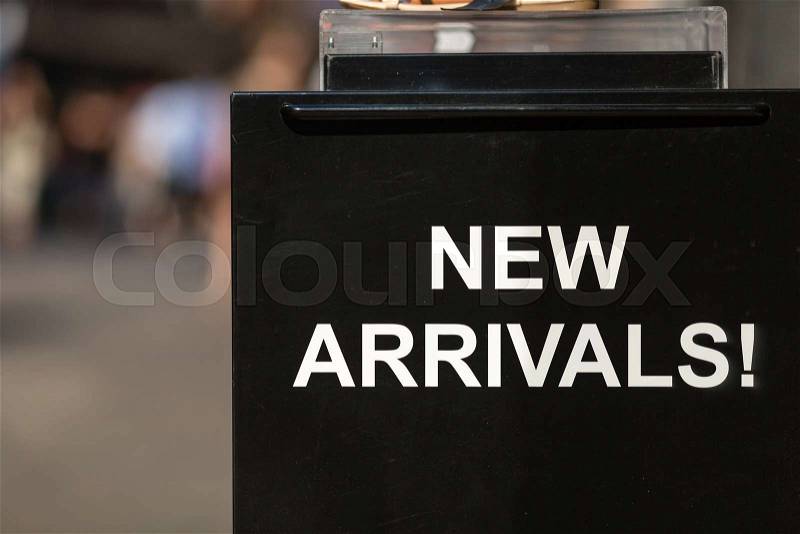 A new arrivals sign outside a footwear store, stock photo
