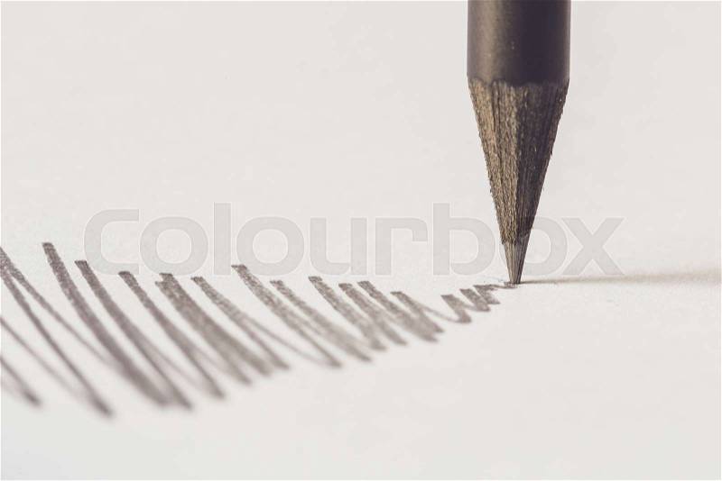 Close up Black pencil with stroke on white paper, stock photo