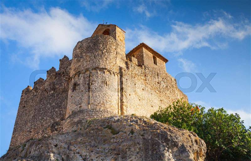 Medieval stone castle on the rock in Spain. Main landmark of Calafell, Catalonia, stock photo