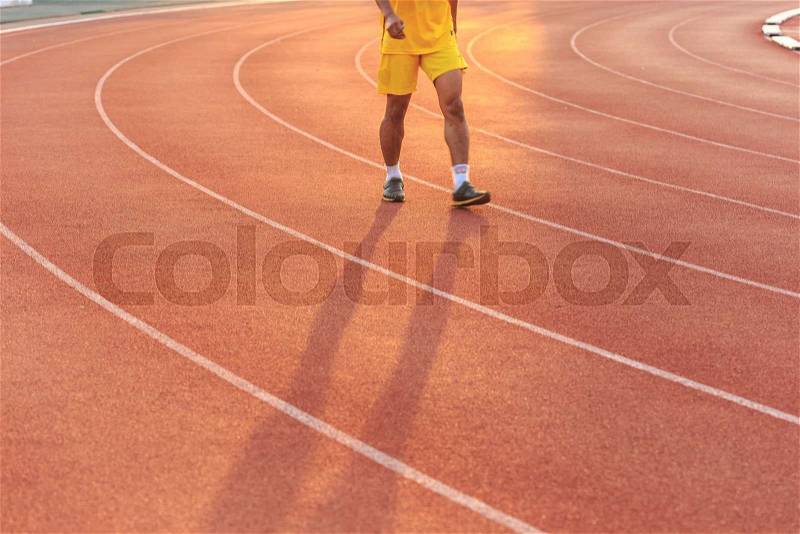 Close up Running track with blur of runner feet in stadium, stock photo
