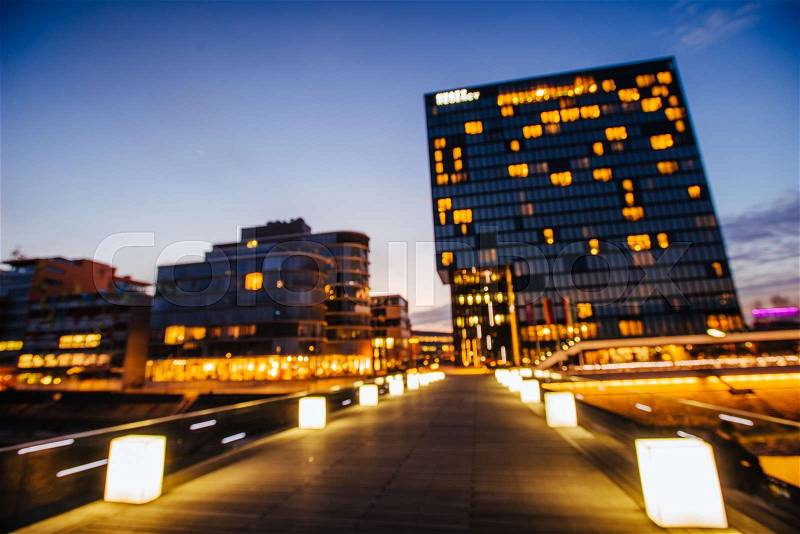 Night city Dusseldorf. hotel Hyatt.Germany. Natural blurred background. Soft light effect, stock photo