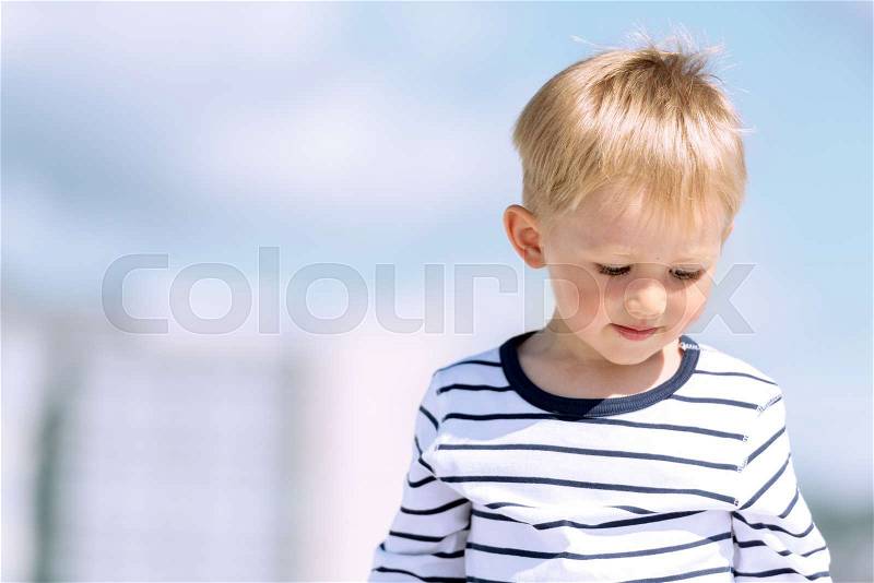 Portrait of little preschool boy outdoors copy space, stock photo