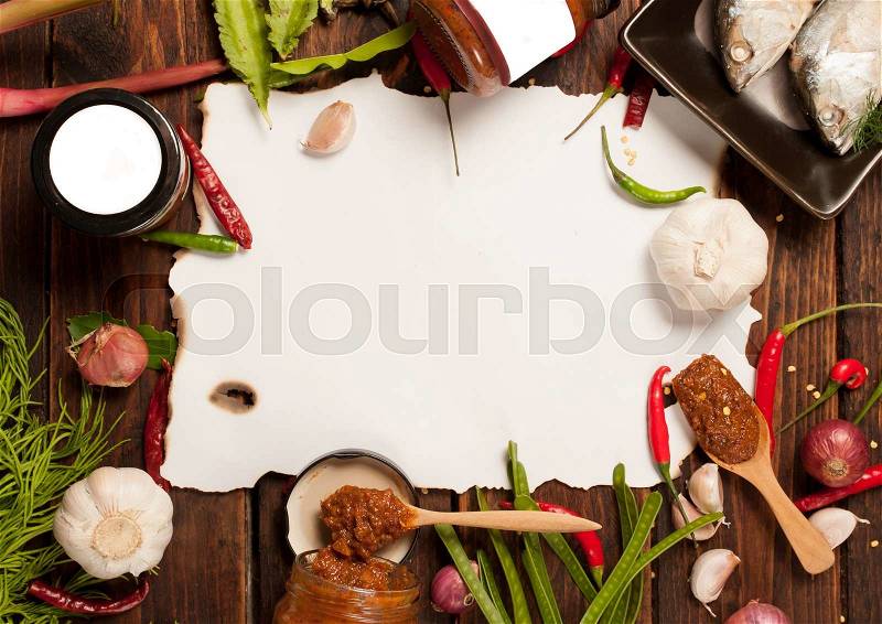 Thai kitchen food spice herb pepper grass red onion garlic chilly ginger for cooking original eastern food syle on wood and paper for notes, stock photo