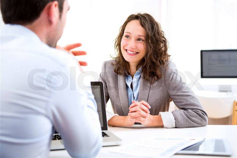 View of a Young attractive woman during job interview, stock photo