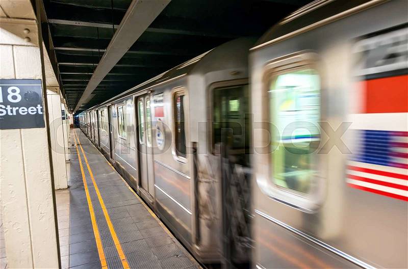Fast moving train in New York subway. 18th street station, stock photo