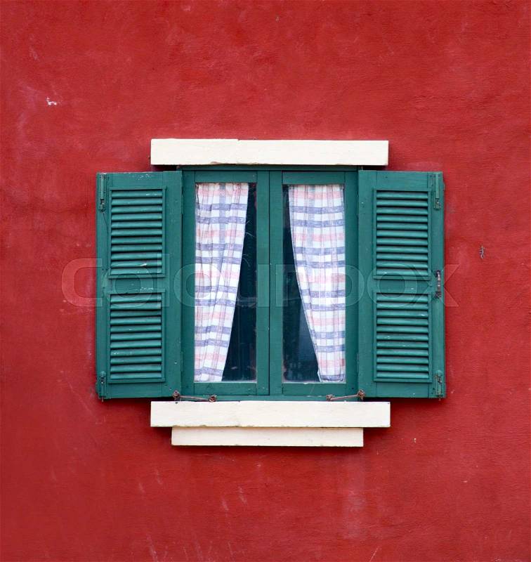 Vintage window on red cement wall, stock photo