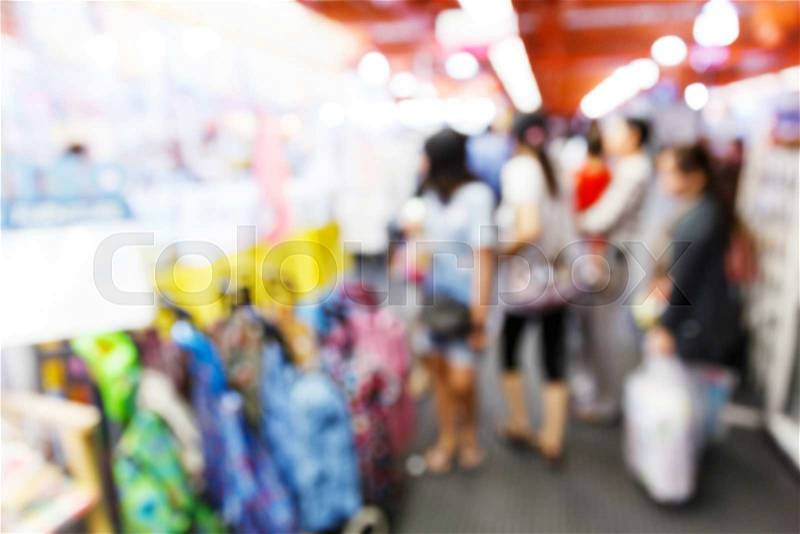 Abstract blurred people walking in shopping center, stock photo