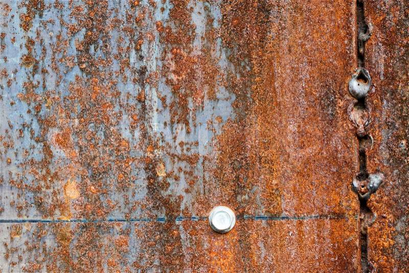 Scratched and rusty orange metal surface as background, stock photo