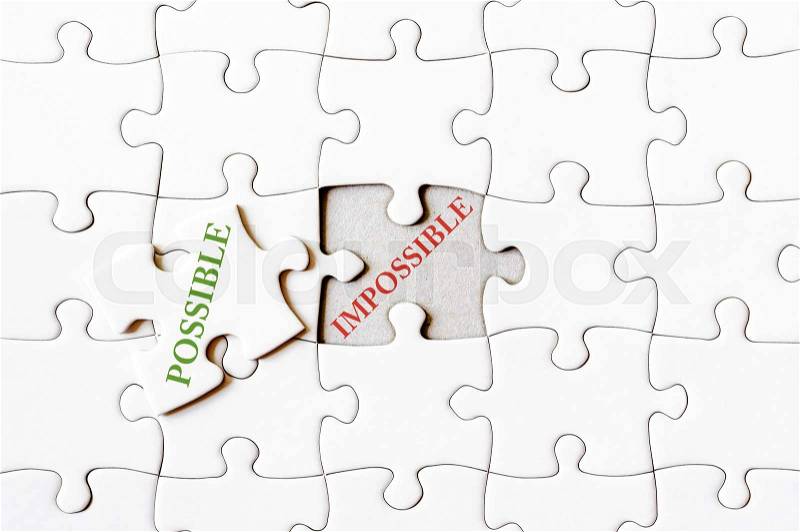 Missing jigsaw puzzle piece with word POSSIBLE, covering text IMPOSSIBLE. Business concept image for completing the final puzzle piece, stock photo