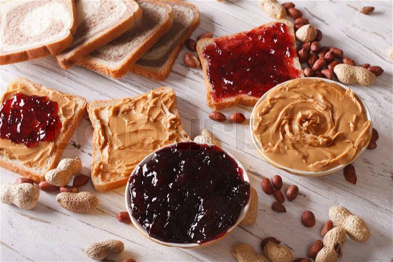 Toast with peanut butter and jelly close-up on the table. horizontal , stock photo