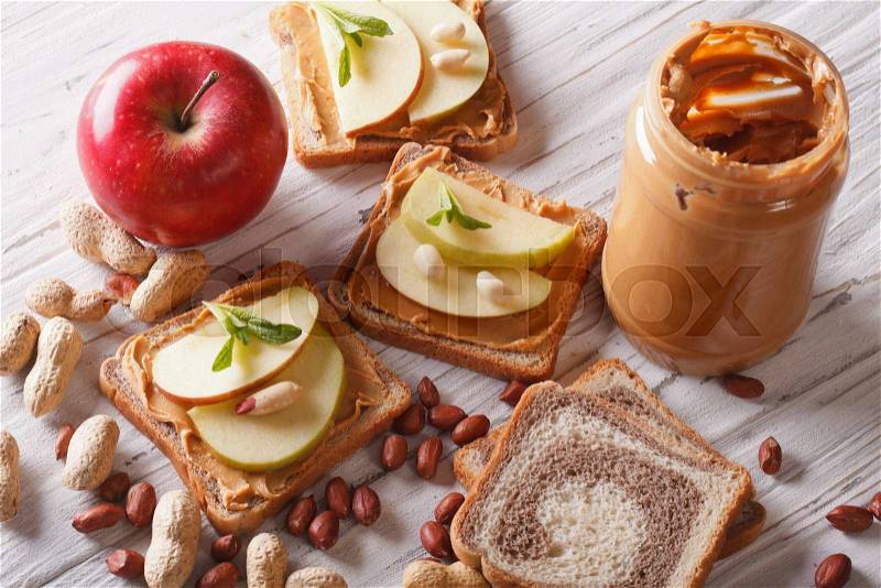 Healthy sandwiches with an apple and peanut butter. horizontal view from above , stock photo