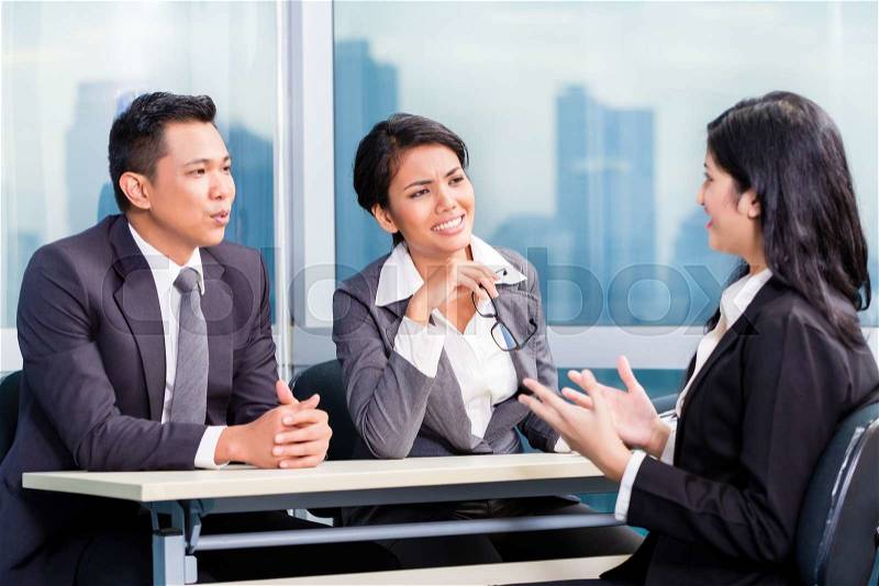 Asian recruitment team hiring candidate in job interview, stock photo